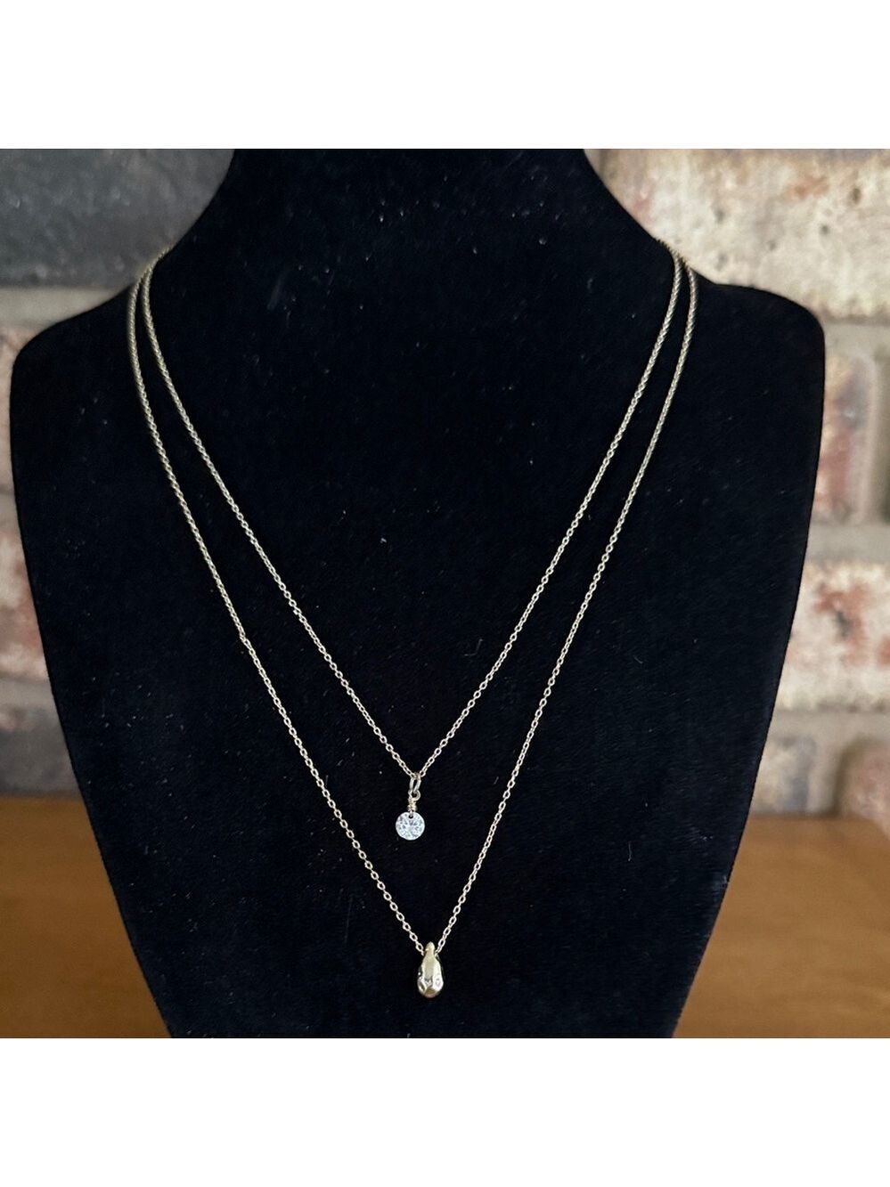 Double strand dainty gold tone necklace with teardrop pendant and rivoli stone